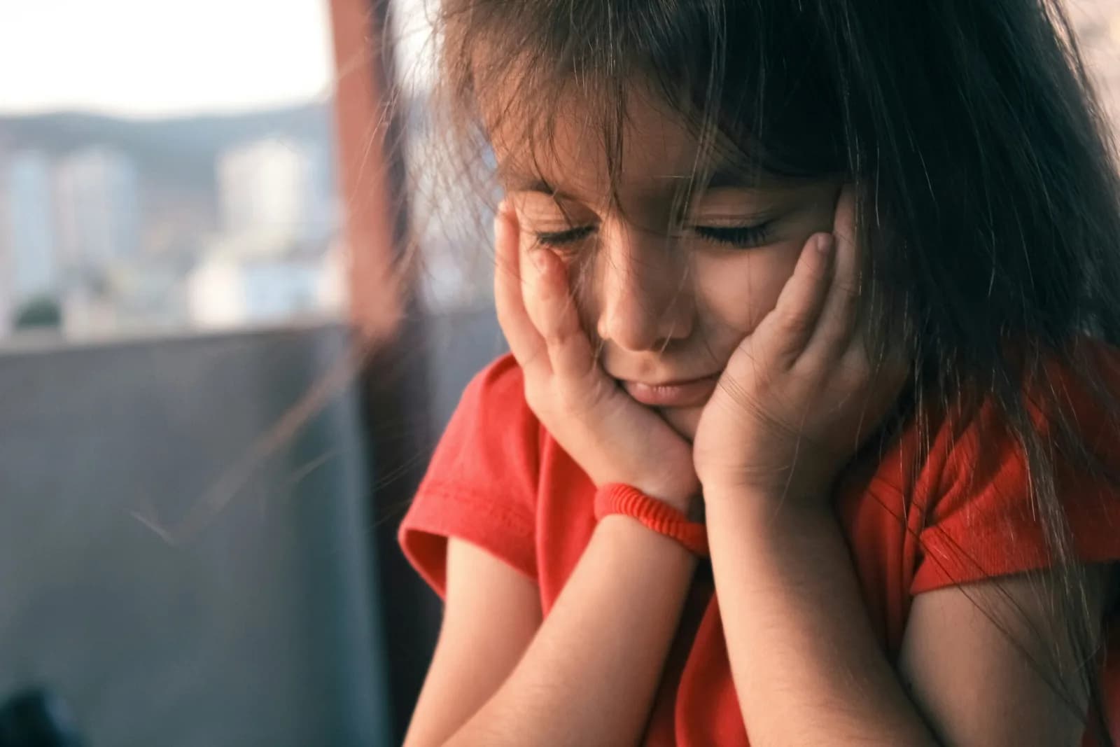alt="Parent helping autistic child develop independence at home"