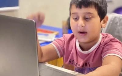 A child smiling during a learning session