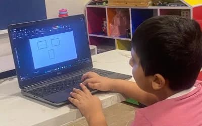 A child using a laptop in class