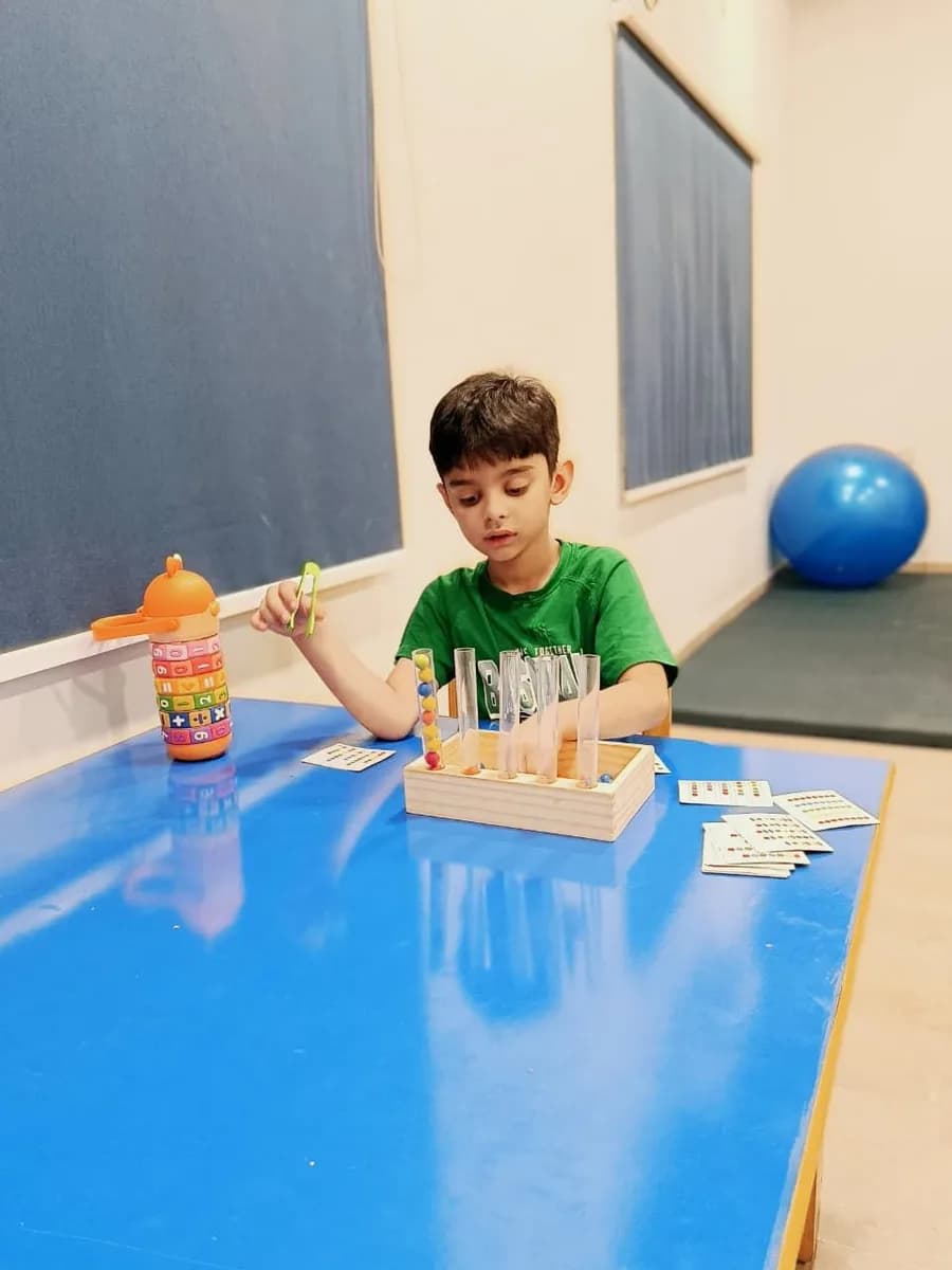 A teacher guiding a child through an activity