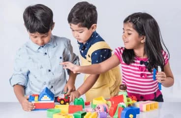 Children working together on a floor puzzle