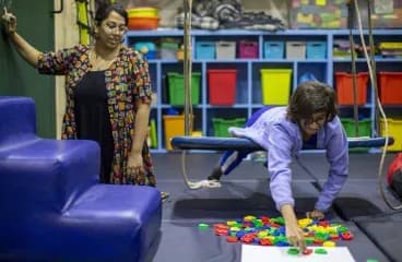 A child playing in a colourful sensory room
